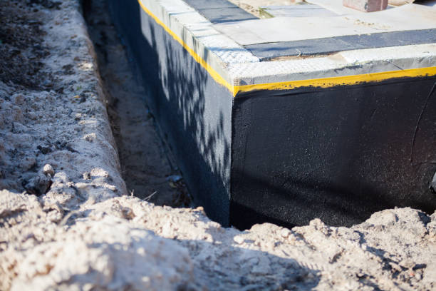 Professional Waterproofing technician working in Midland, VA